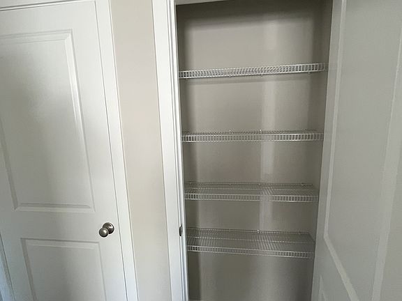 downstairs pantry next to kitchen and large storage closet