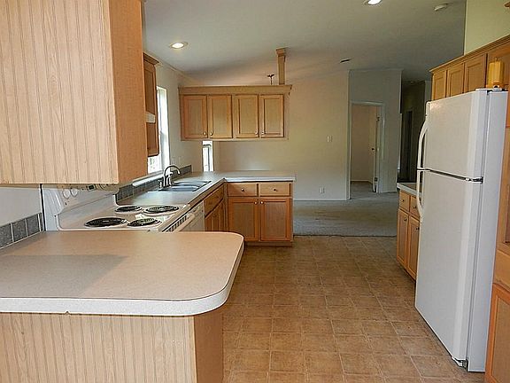 The refrigerator stays with the home.