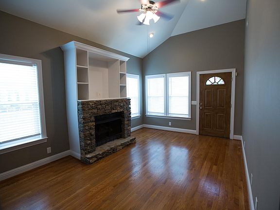 Front room with gas fireplace. View from Kitchen