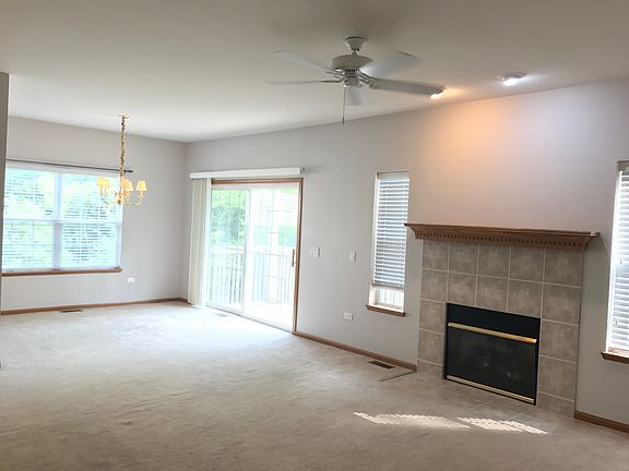 Nice family room fireplace and sliding door access to deck.