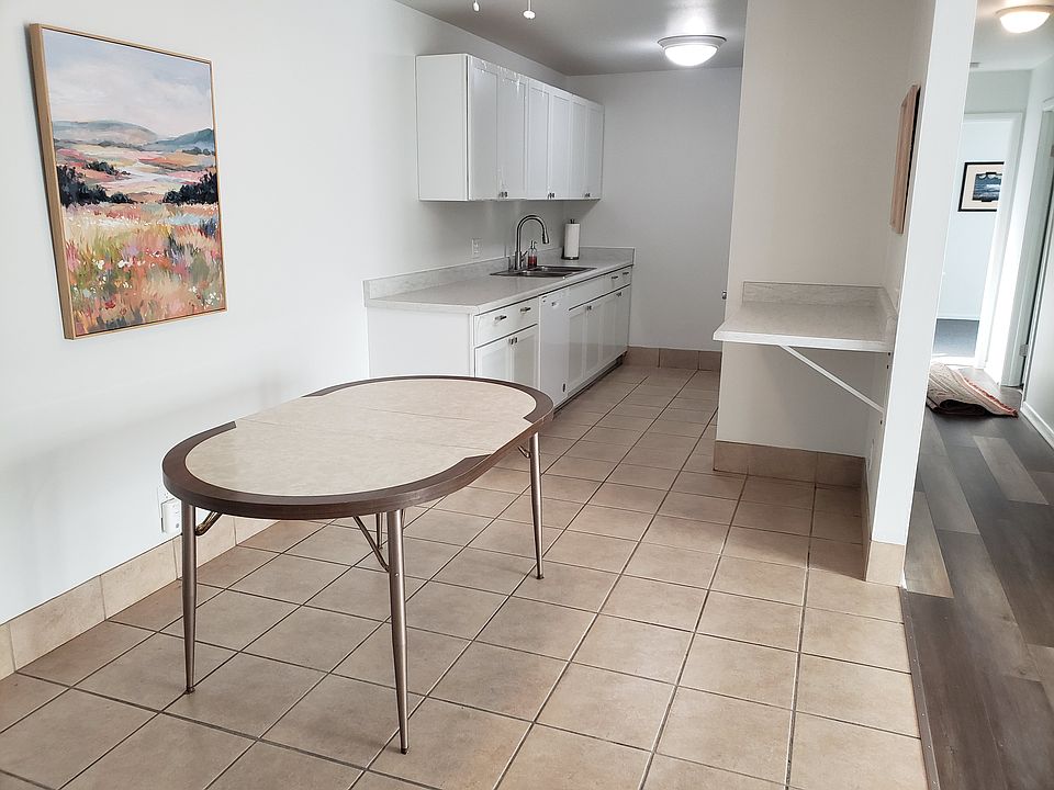 Kitchen with dining area and breakfast bar. New cabinets. New countertop. New dishwasher. Fresh paint.