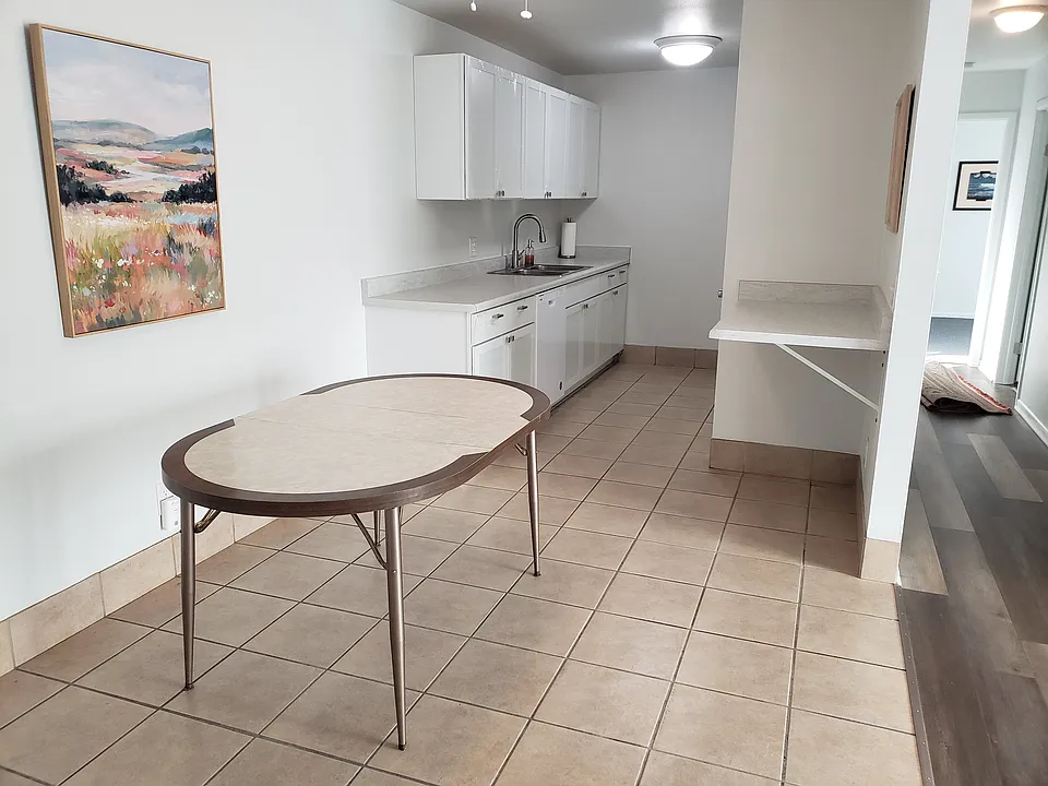 Kitchen with dining area and breakfast bar. New cabinets. New countertop. New dishwasher. Fresh paint.