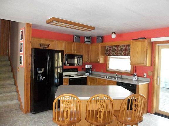 Bright sunny kitchen with an island work station.