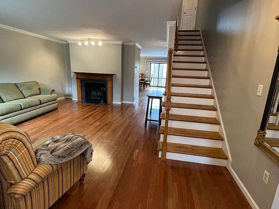 Living room New hardwood flooring on entire first floor. Wood burning fireplace