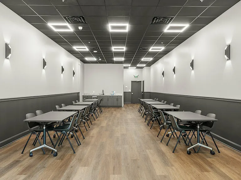 Experience a refined and adaptable meeting space designed for productivity.