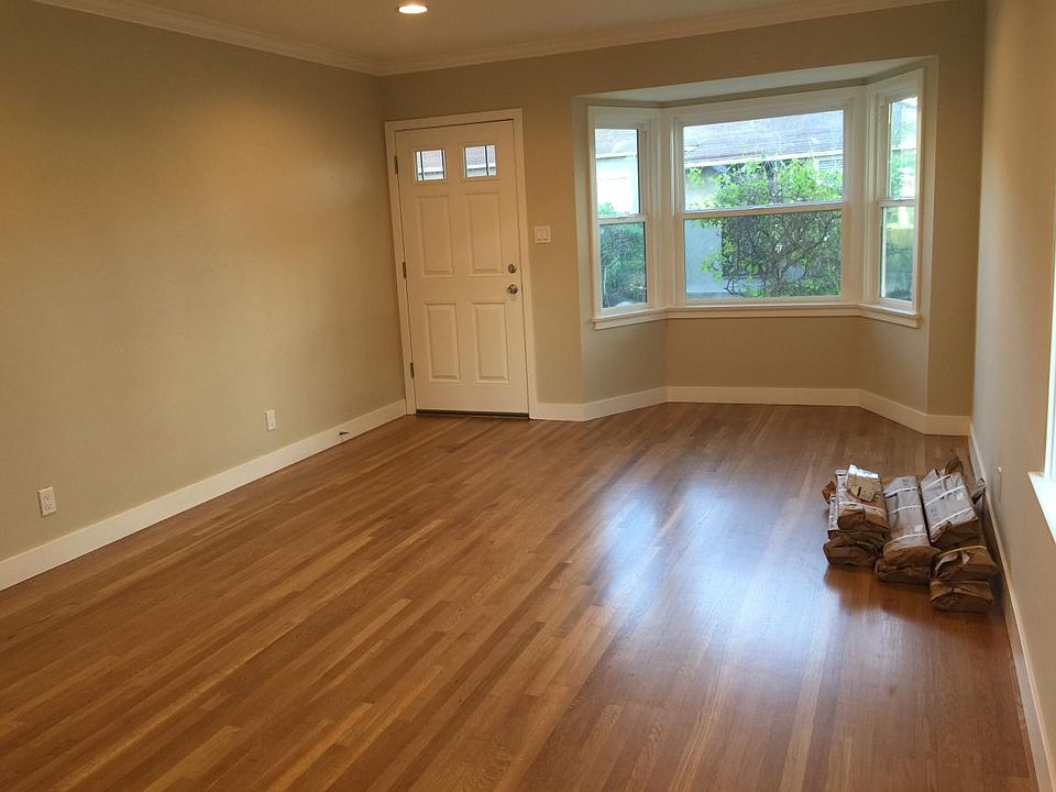Living room with refurbished 1940's hardwood floor with new