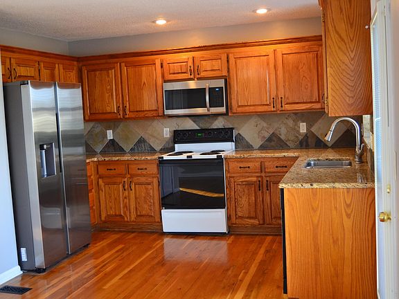 Kitchen with all new stainless steal appliances. (Range and dishwasher are shipping in Feb.)