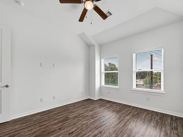 Spacious third-floor primary suite with high ceilings.