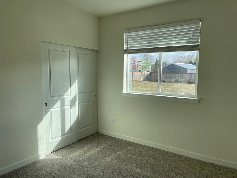 Primary bedroom with attached 3/4 bath.