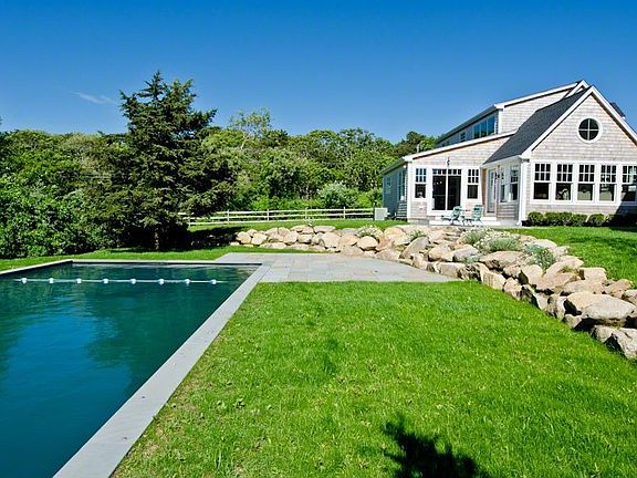 Pool Area Framed With Rock Wall
