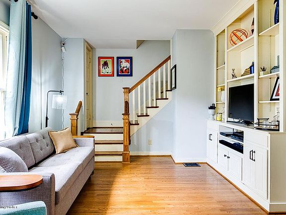 Light filled living room with built in storage.