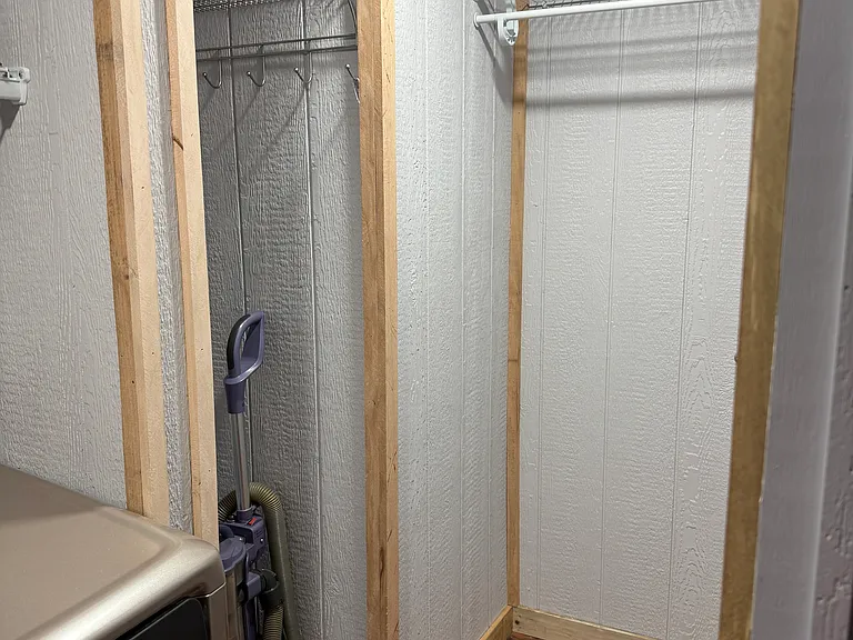 Laundry room hanging space and broom vac space. Lots of storage in the laundry room.