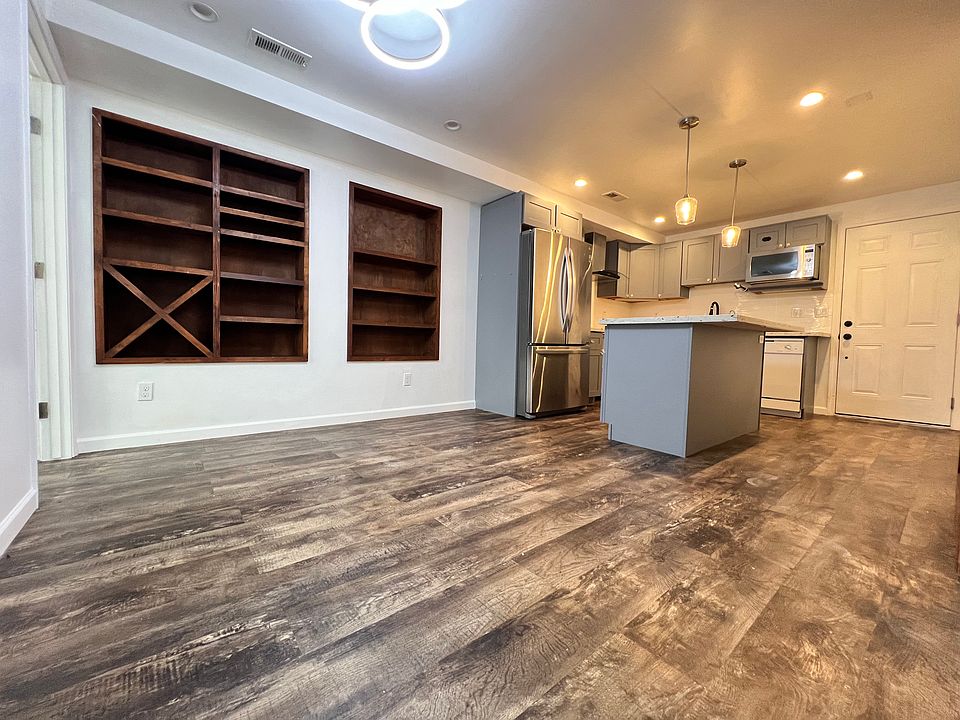 Kitchentte open space with dine-in area. Large enough to fit 6 person dining table. Built in shelves.