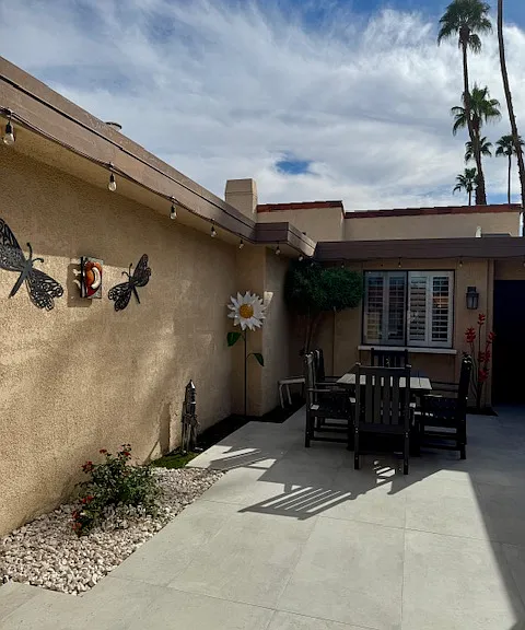 Front courtyard with dining table.