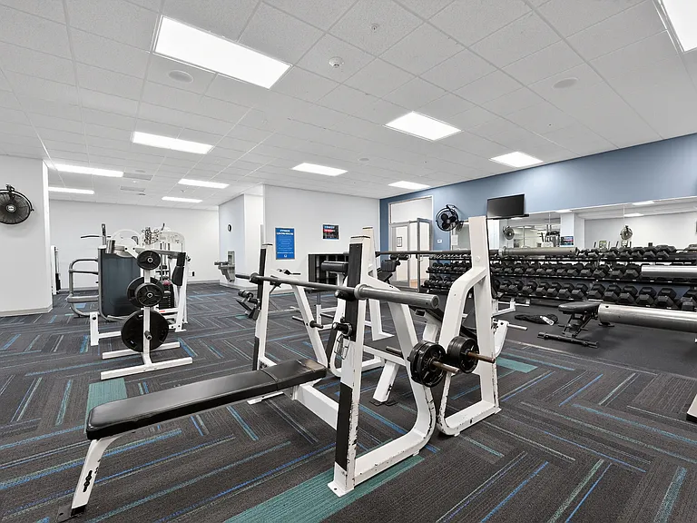 Spacious Gym with Variety of Workout Machines at University Plaza NIU Apartments