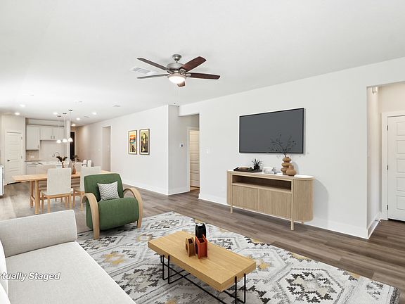 Virtually staged living room in the Hughes floorplan at a Meritage Homes community.
