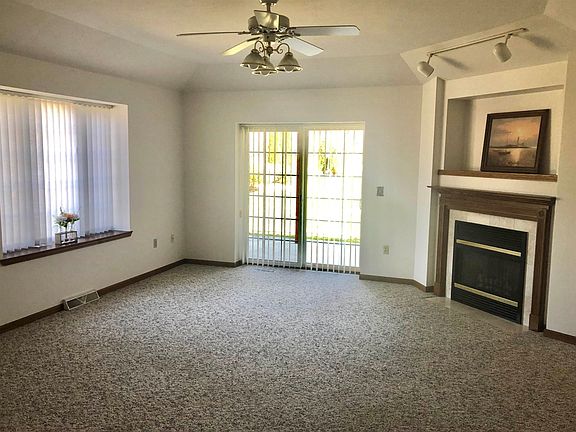 Gas fireplace patio doors to fabulous yard space.