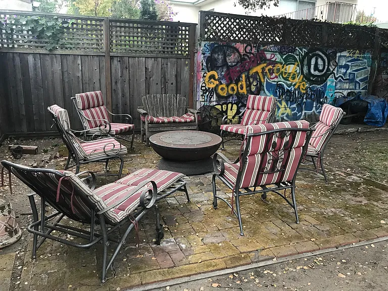 Rear Yard Patio Seating with Fire Pit and Graffiti Wall