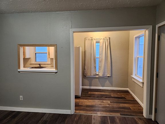 Looking into the dining room and kitchen pass thru from the living room.