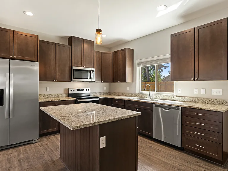 Kitchen, with granite countertops and stainless steel appliances.