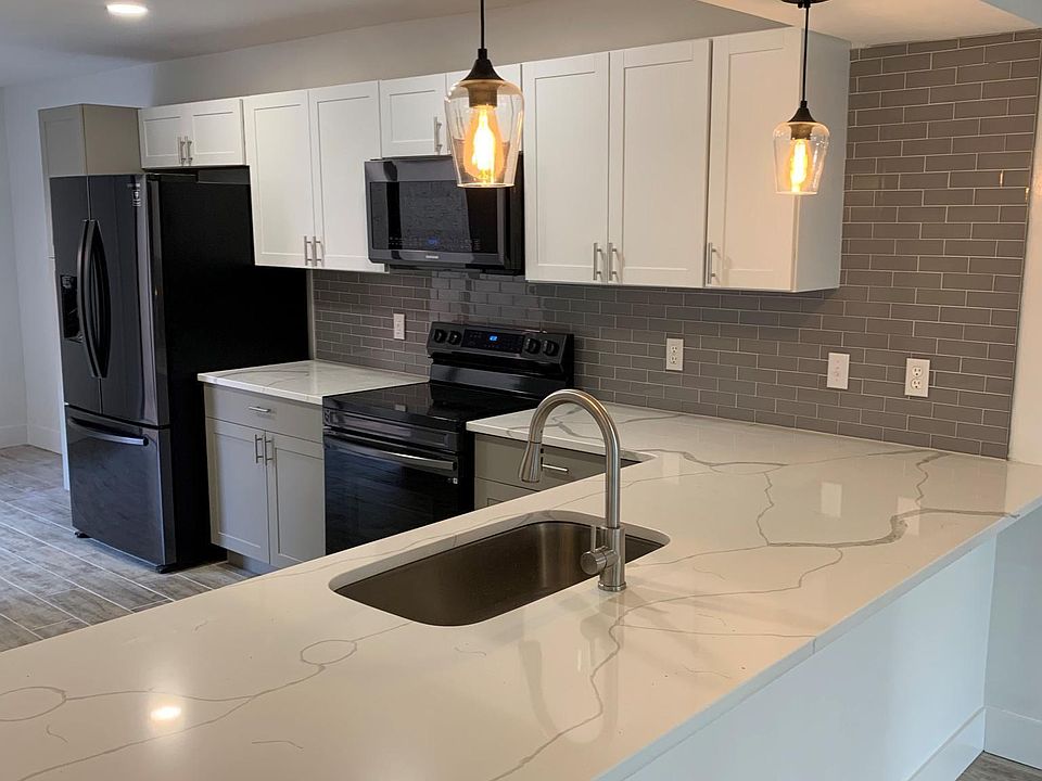 Kitchen with new appliances and Quartz countertops