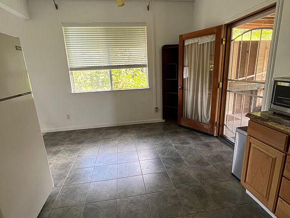 Dinette area + back door entrance/exit to shared covered lanai-storage-bbq area