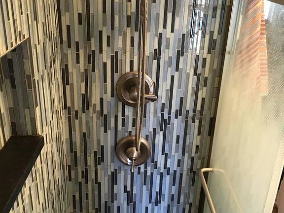 Walk in shower with seat and rain head