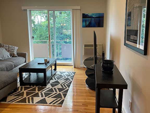 An additional view of the living room with the balcony slider.