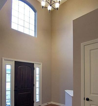 Two story foyer with art niche