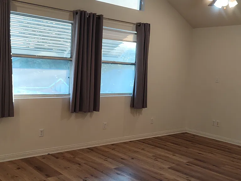 Master bedroom with vaulted ceilings