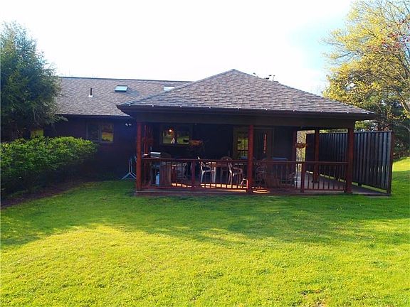 The covered porch is located at rear of the home.