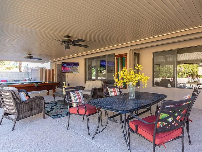Sitting area and dining area on this massive covered patio!