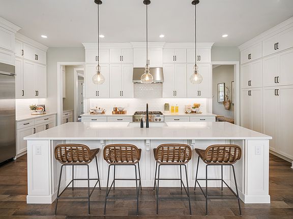 Amazing kitchen with large center island and walk-in pantry