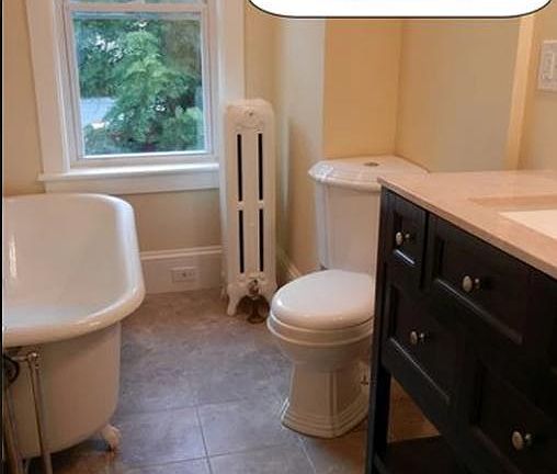 100+ year old claw foot tub and water saving toilet.