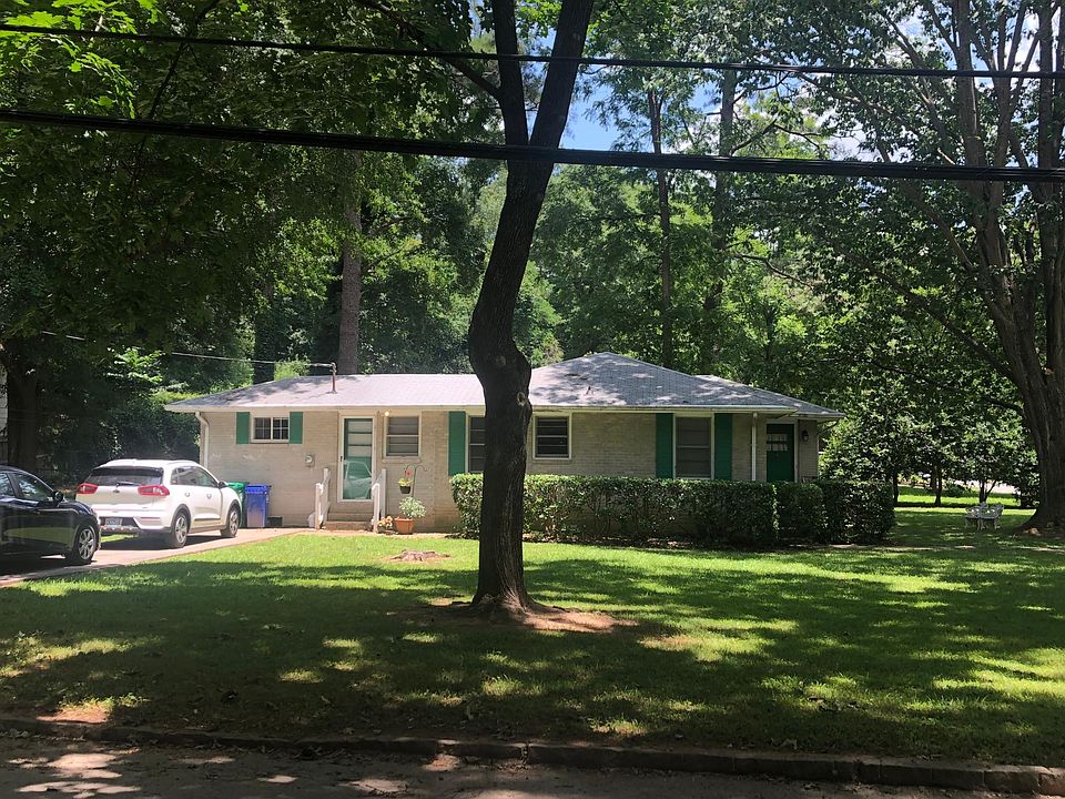 Nearly half acre of level, shaded grass, fenced in back yard