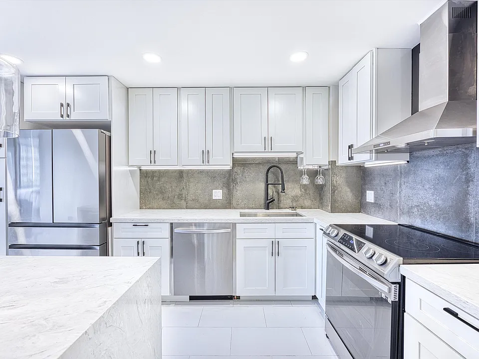 New stainless steel appliances and cabinetry.