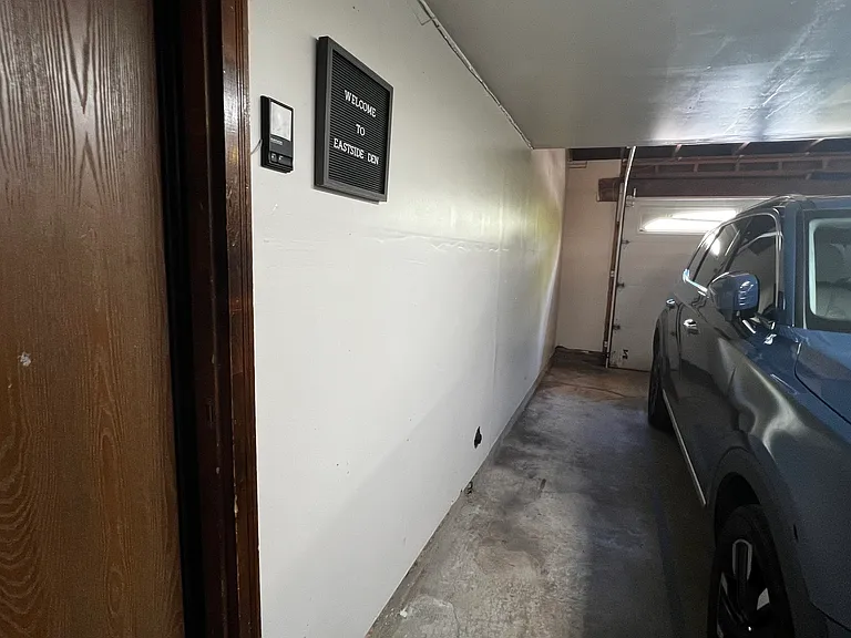 Dedicated guest parking and garage entry provide convenient access to Eastside Den.