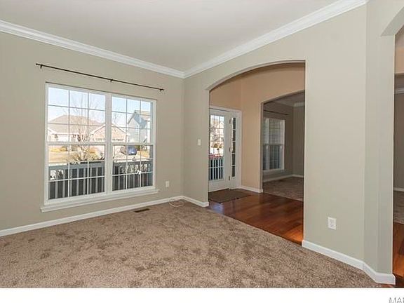 Formal living room with arched openings.
