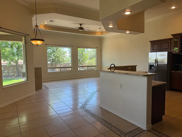Kitchen and separate living area with space for eat-in dining table