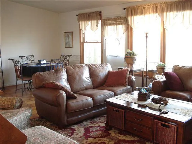 The quaint living and dining room areas are directly off the kitchen and offer an easy, comfortable atmosphere.