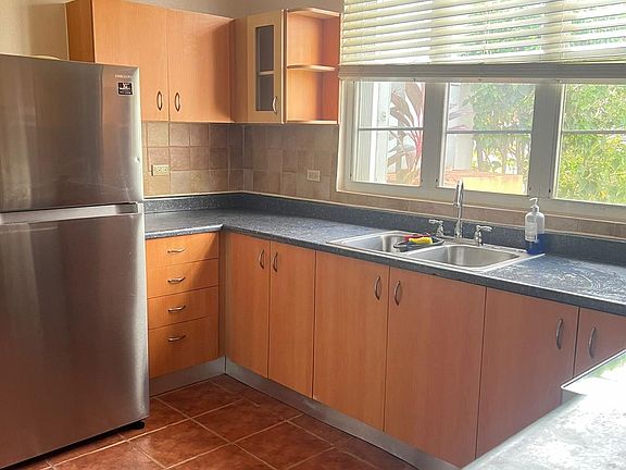 Kitchen 
Hummingbirds love the hibiscus bushes in front of the window.