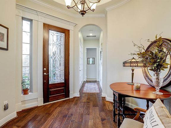 Large entryway off of the Courtyard. Love the wood floors.