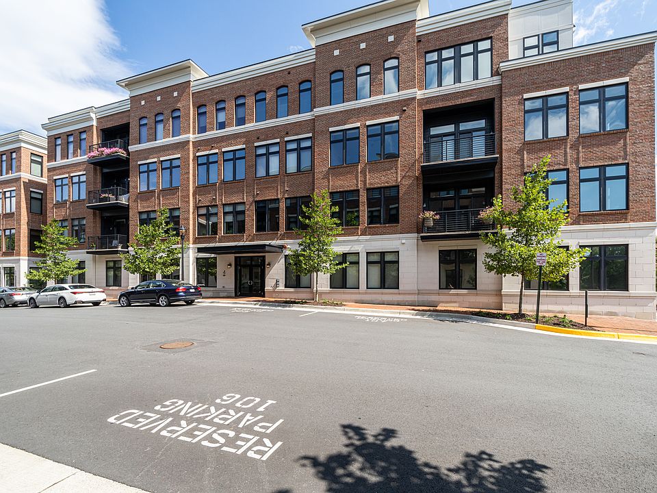 Building exterior and street. The unit has its own reserved parking space, which is located directly outside the apartment, on the street.