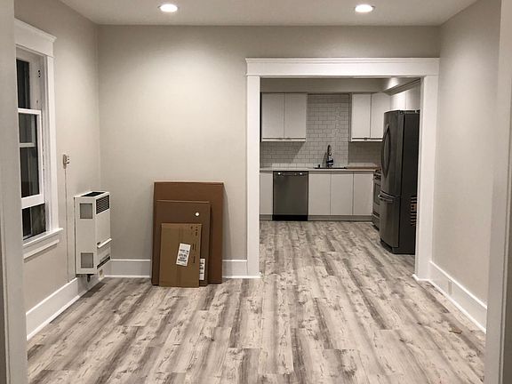 View from front "sunroom" entry, through living room, into kitchen