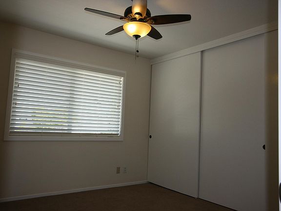 Bedroom ceiling fan draws in ocean breeze & dual glazed windows