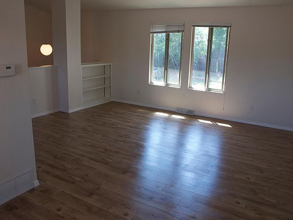 View to the living room from the dining room. Large, open living!
