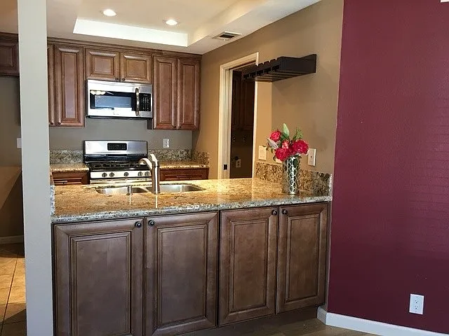 kitchen with gas range, micro, dishwasher, walk in pantry and inside washer and dryer