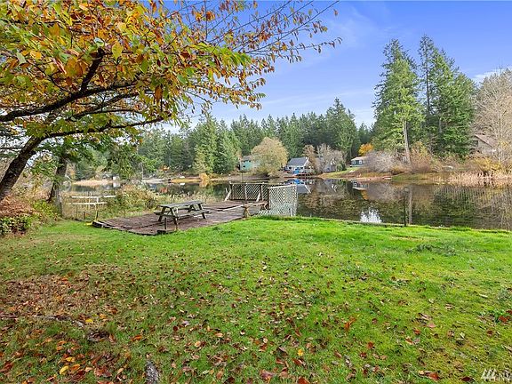 This nearly half-acre property comes with a dock, as well.