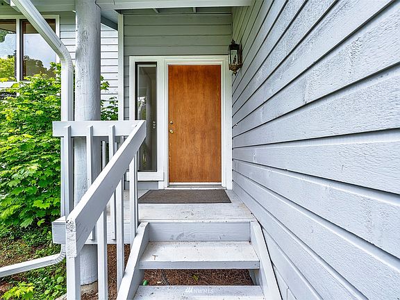 Covered front porch. Door has been painted since this photograph.