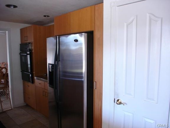 Door to walk-in Pantry. Refrigerator included.